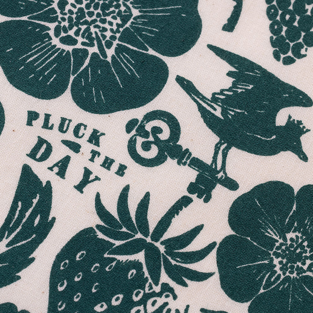 Close-up of the white bandana's key, bird, and berry print