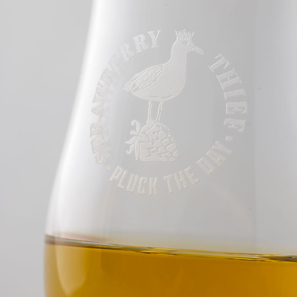 Close-up of the Strawberry Thief seagull-and-berry glass etching
