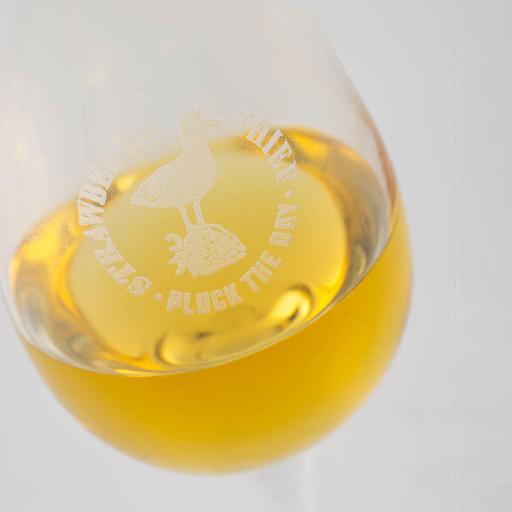 Close-up of the Strawberry Thief glass etching above the spirit